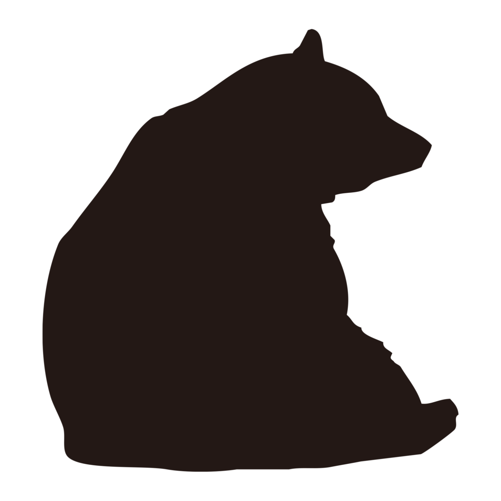 横から見た、座っているクマのシ
