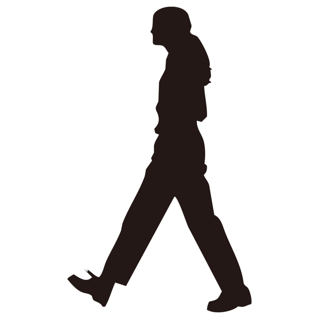 颯爽と歩く、パンツスタイルの女