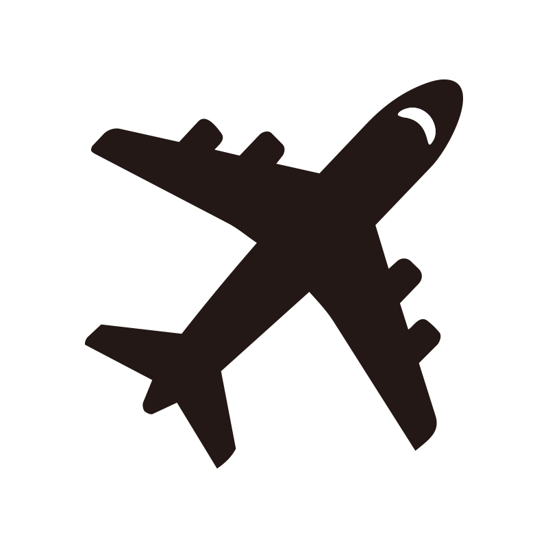 大空を飛行する航空機のシルエッ