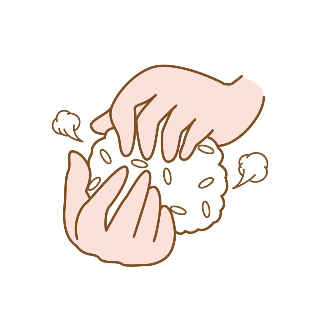 おにぎりを握る手のイラストです